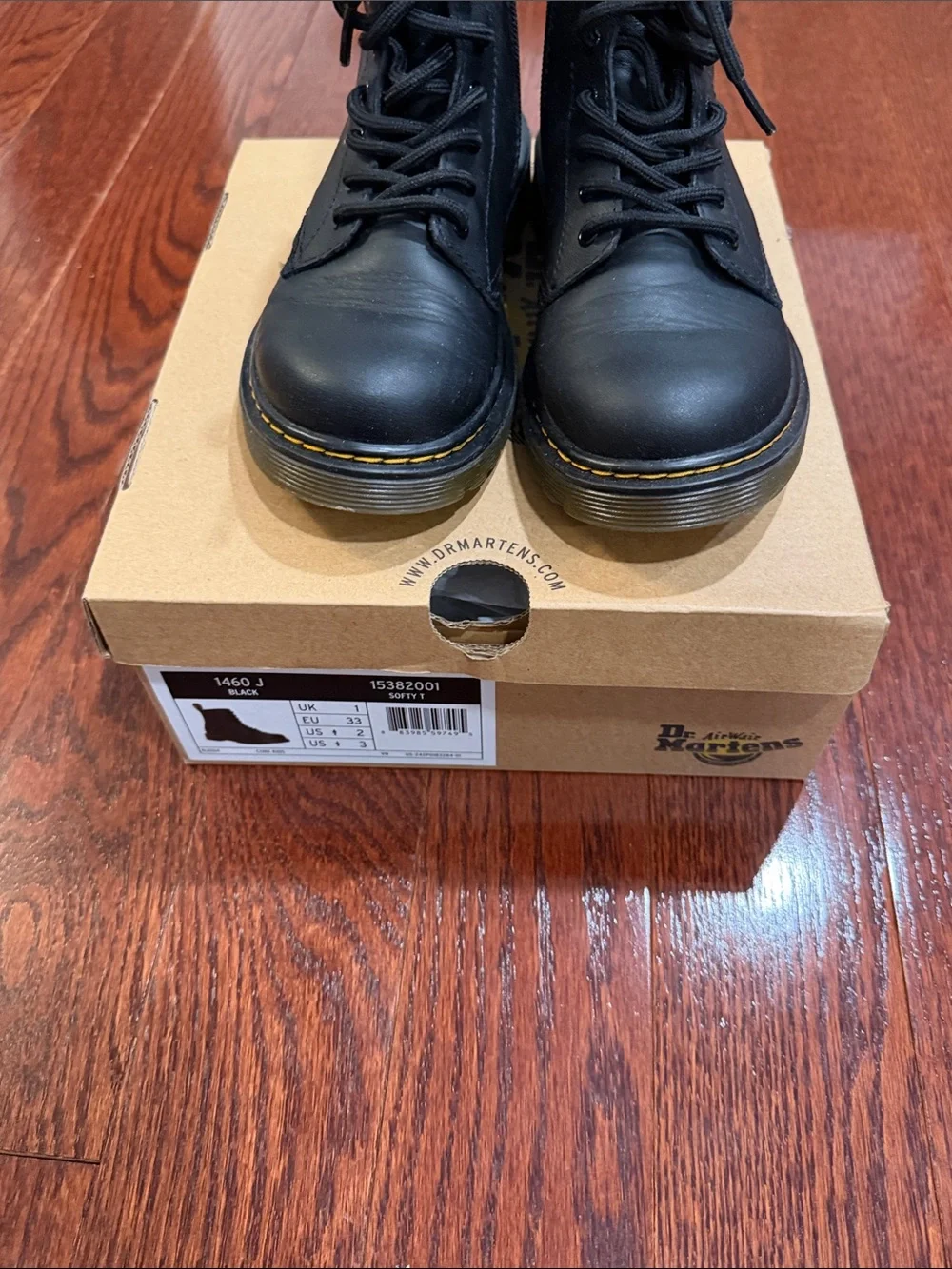 Dr. Martens Black Leather 8-Eye Lace-Up Boot with Yellow Heel Loop